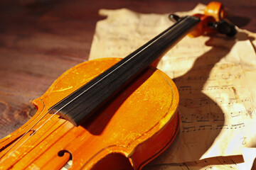 Rare violin and vintage sheet music closeup.
