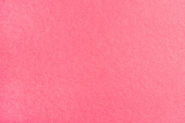 A sheet of colored paper with a non-uniform color. Neutral paper texture.