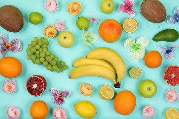 Summer tropical fruits on a bright table, patern. Detox diet and weight loss concept, top view, healthy and natural food, source of vitamin C, banner for store, selective focus