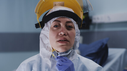 Exhausted medical practitioner in face shield