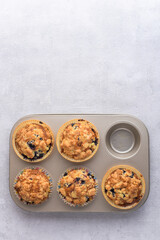 Delicious crumble muffins in baking form