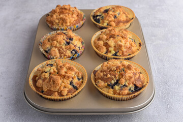 Delicious muffins in baking form