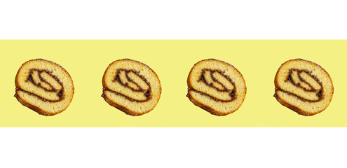Biscuit roll slices isolated on yellow background, with fruit jam. Patern. Homemade baking.