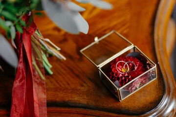 Wedding rings in a beautiful glass box on the table