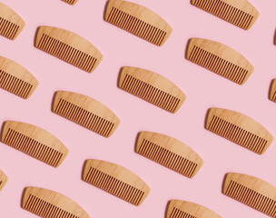 wooden comb on a colored background