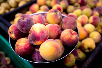delicious ripe peaches for sale at an urban street market