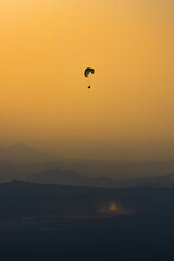 paragliding at sunset