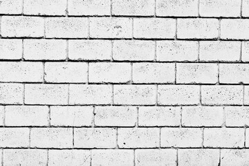 Texture of a brick wall with cracks and scratches which can be used as a background