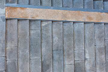 Granite staircase top view. Abstract architectural gray background. City stairs in parks, squares, embankments. Close-up of the stone steps. Conceptual modern minimalistic design, parallel lines