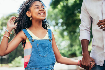 Father and daughter enjoying a day outdoors.