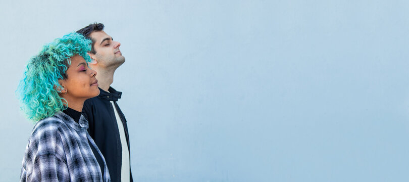 portrait of concentrated multiethnic couple breathing