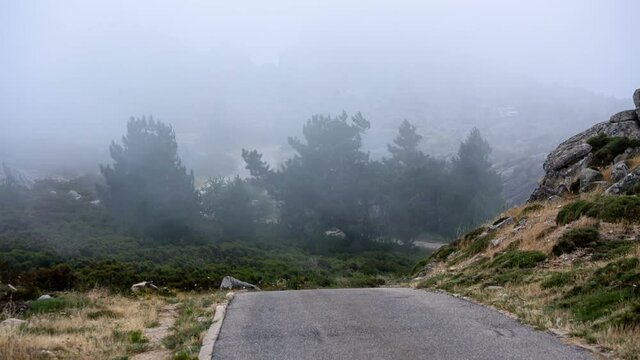 Storm clouds passing over the Monte Limbara road near the mountain top in Sardinia, Italy