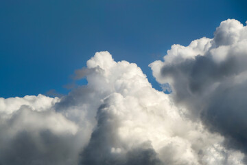 Obraz premium beautiful clouds in the blue sky, illuminated by sunlight. Horizontal photo.