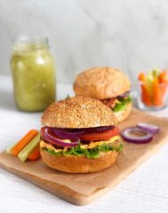 Fototapeta na wymiar Burger with vegetables and smoothie 