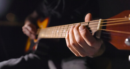 Playing on the guitar closeup footage