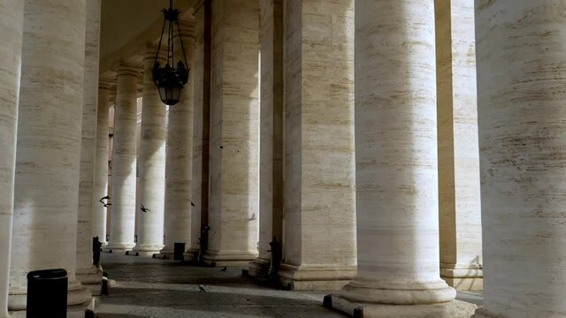 Walking along the path decorated with travertine columns and candliers of the Vatican square, feeling the atmosphere of spirituality and miracles of the Christian heart