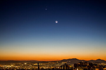 Moon dusk over the city © serazor