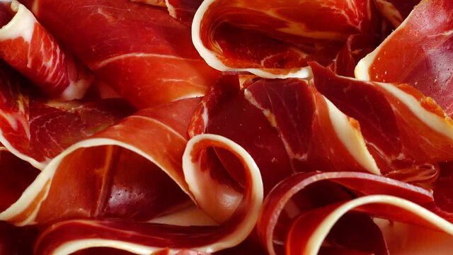 Jamon on the plate. Shooting in motion.