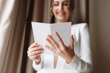 Wedding day. Fees at the hotel. the bride near the window and reads the letter to the groom....