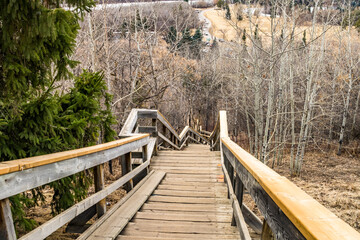 Stairs with red spots marked for repair leeds downhill to Hawrelak Park area, Edmonton, Alberta