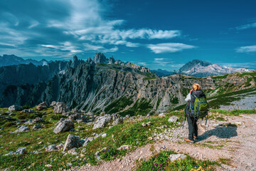 Fototapeta premium Backpacker on hiking trails in the Dolomites, Italy.