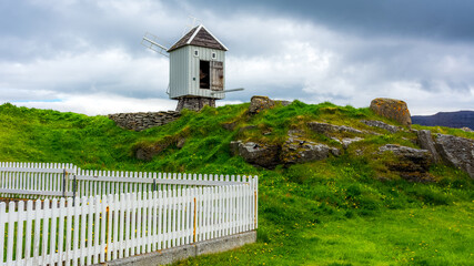 the oldest wooden windmill in Iceland on Vigur island during summer season