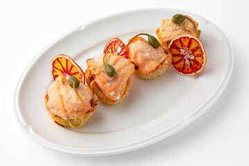 Large pieces of fillet baked with salmon cheese and sauce. Banquet festive dishes. Gourmet restaurant menu. White background.