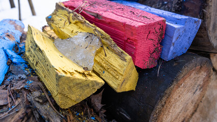 Woodpile with colorful pieces of wood and timbers