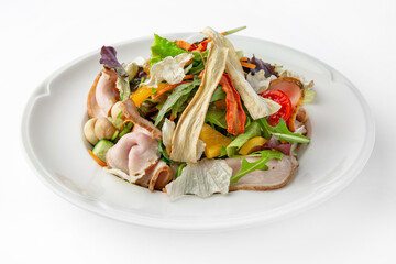 Salad with pork, mushrooms, vegetables and herbs. Banquet festive dishes. Gourmet restaurant menu. White background.