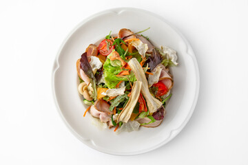 Salad with pork, mushrooms, vegetables and herbs. Banquet festive dishes. Gourmet restaurant menu. White background.