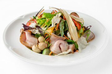 Salad with pork, mushrooms, vegetables and herbs. Banquet festive dishes. Gourmet restaurant menu. White background.