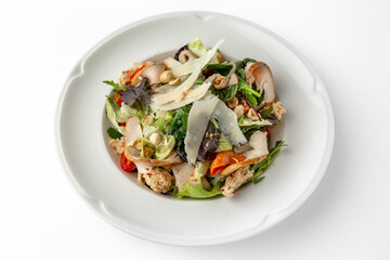 Salad with meat, nuts, seeds, vegetables and herbs. Banquet festive dishes. Gourmet restaurant menu. White background.