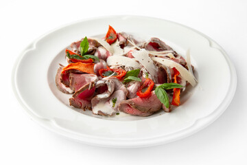 Salad with beef, cheese, vegetables and herbs. Banquet festive dishes. Gourmet restaurant menu. White background.