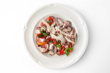 Salad with beef, cheese, vegetables and herbs. Banquet festive dishes. Gourmet restaurant menu. White background.