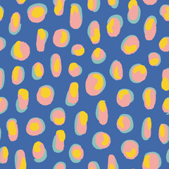 Doodled dots and strokes all over print with blue background. Colorful abstract vector elements overlapped seamless repeat pattern. 