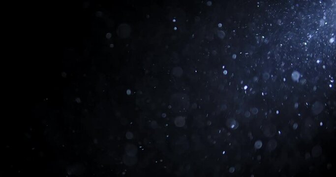 Shot of real dust particles floating in the air. Dust Particles Background. Macro slow motion shot, Use blending mode (screen) 