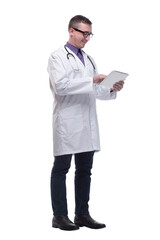 Side view of confident doctor wearing uniform and glasses using digital tablet