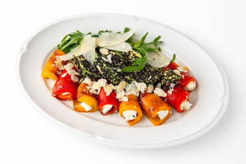 Appetizer of grilled sweet peppers. Rolls stuffed with cheese. Banquet festive dishes. Gourmet restaurant menu. White background.