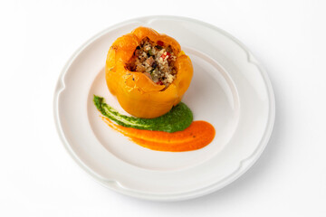 Sweet peppers stuffed with rice, vegetables and meat, baked in the oven. Banquet festive dishes. Gourmet restaurant menu. White background. 