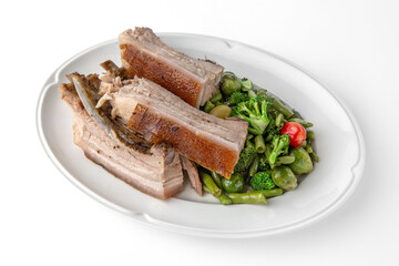 Large pieces of pork baked in spices. Banquet festive dishes. Gourmet restaurant menu. White background.