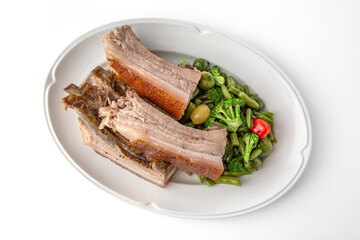 Large pieces of pork baked in spices. Banquet festive dishes. Gourmet restaurant menu. White background.