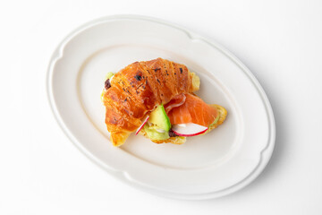 Mini sandwich with salmon, avocado, truffle oil. Beautifully decorated catering banquet menu. Food snacks and appetizers for buffet. Isolated on white background