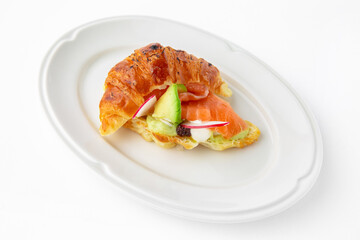 Mini sandwich with salmon, avocado, truffle oil. Beautifully decorated catering banquet menu. Food snacks and appetizers for buffet. Isolated on white background