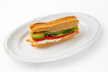 Vegetarian mini sandwich with cheese, tomato, cucumber, zucchini. Beautifully decorated catering banquet menu. Food snacks and appetizers for buffet. Isolated on white background