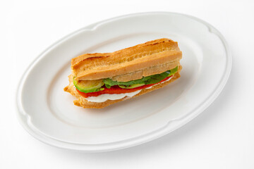 Vegetarian mini sandwich with cheese, tomato, cucumber, zucchini. Beautifully decorated catering banquet menu. Food snacks and appetizers for buffet. Isolated on white background