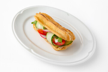 Vegetarian mini sandwich with cheese, tomato, cucumber, zucchini. Beautifully decorated catering banquet menu. Food snacks and appetizers for buffet. Isolated on white background