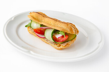 Vegetarian mini sandwich with cheese, tomato, cucumber, zucchini. Beautifully decorated catering banquet menu. Food snacks and appetizers for buffet. Isolated on white background