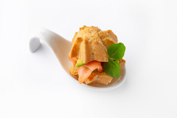 Mini sandwich with salmon, avocado, truffle oil. Beautifully decorated catering banquet menu. Food snacks and appetizers for buffet. Isolated on white background