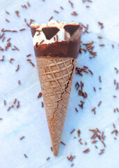 Chocolate ice cream cone with chocolate sprinkles