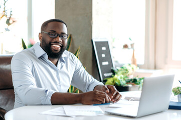 Successful handsome confident bearded african american businessman, real estate agent or ceo...
